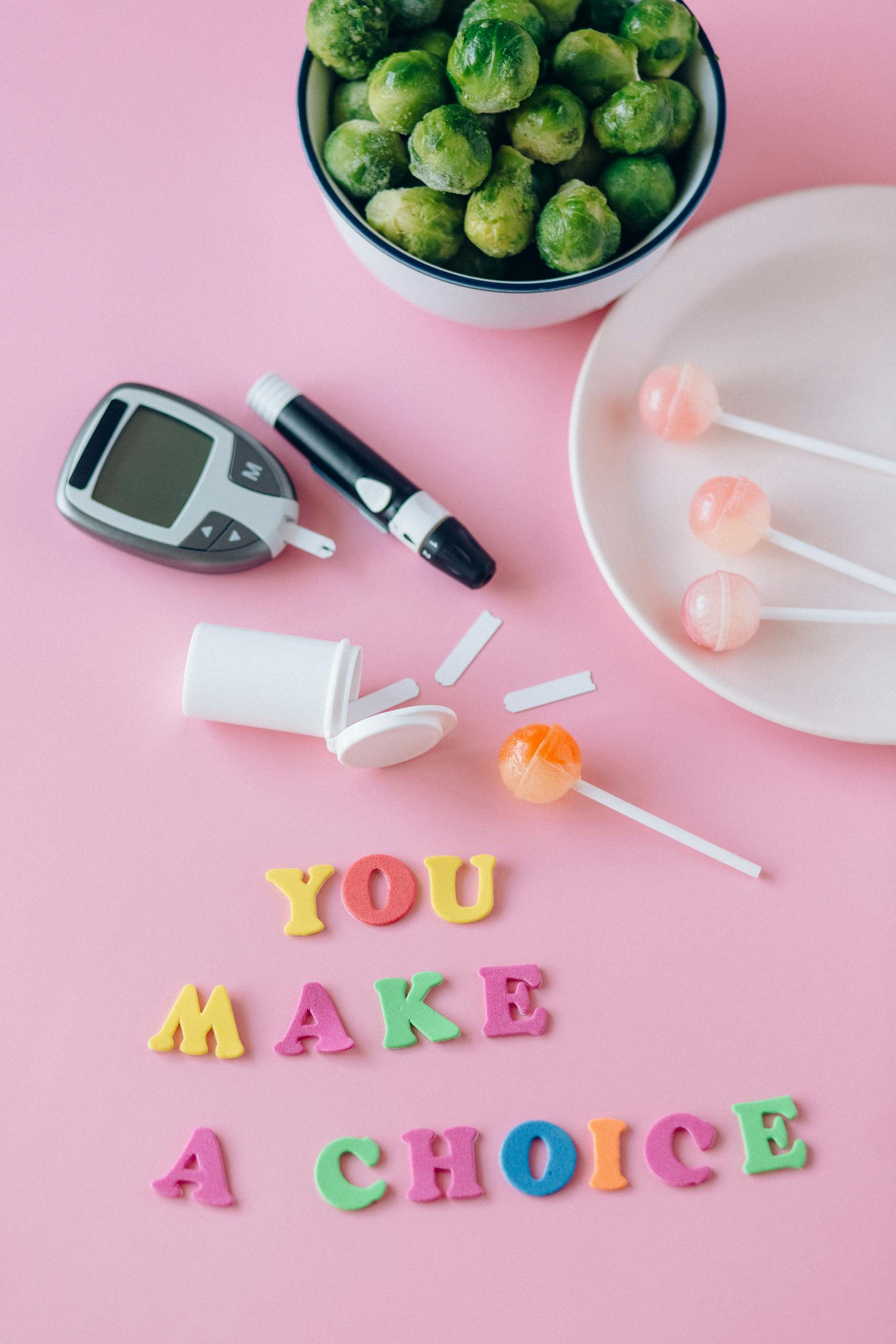 Brussels sprouts, glucometer, and lollipops symbolize choices in managing diabetes.